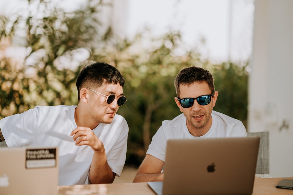 men in front of laptop