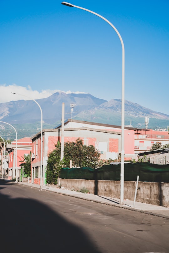 white street light near building in Mount Etna Italy