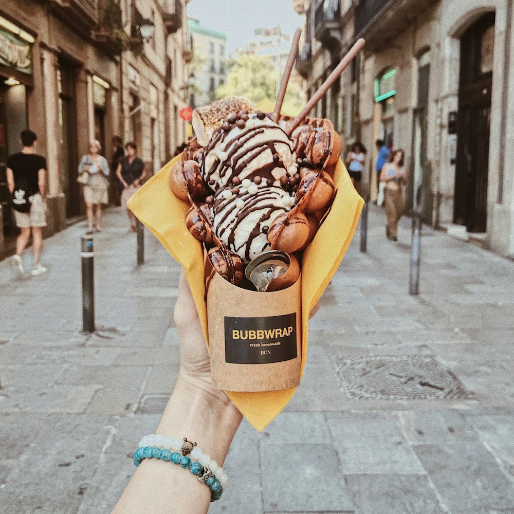 person holding Bubbwrap icecream