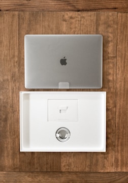 Stack of new laptops ready for delivery with xgen infotech branding.