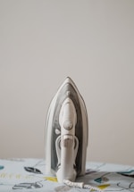 used white and gray steam iron
