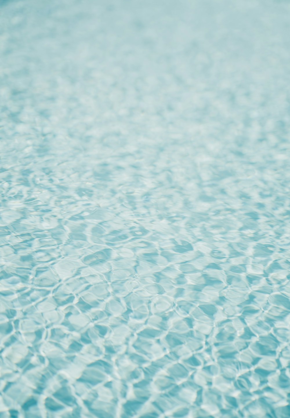 a blue pool with water ripples in it