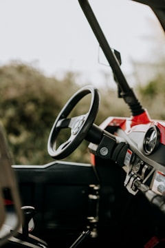 Close-up of the dashboard and controls inside an electric three-wheeler.