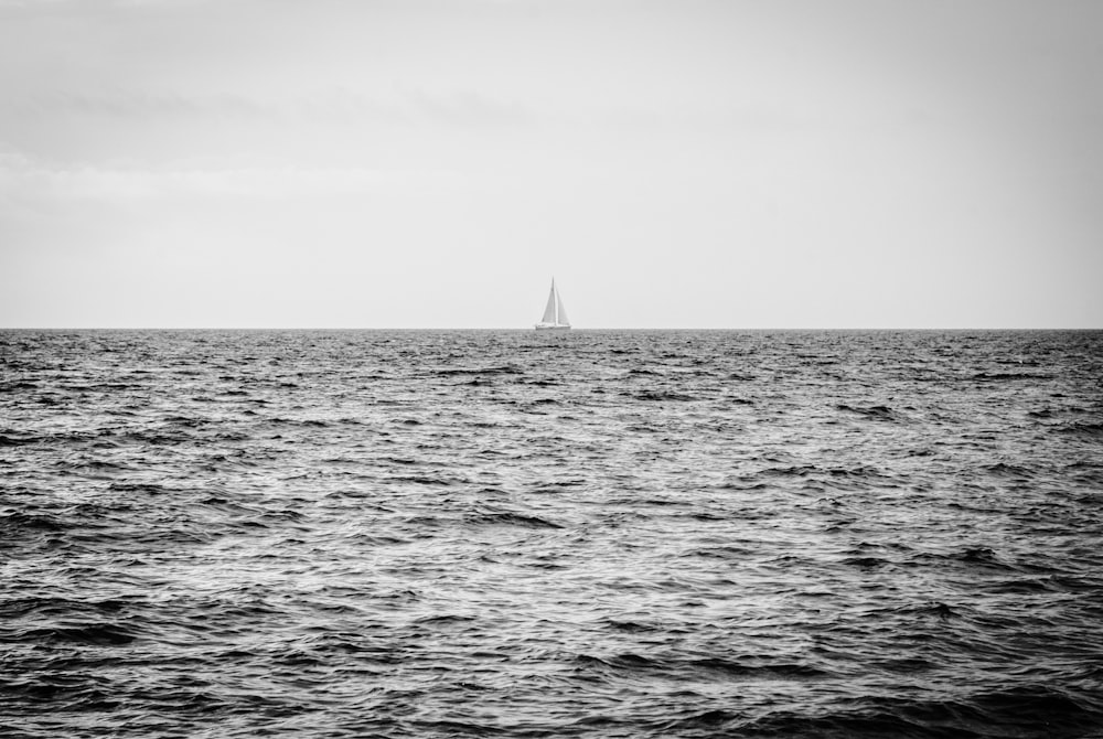 sailboat in the middle of ocean