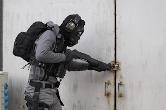 person wearing armor suit carrying shotgun