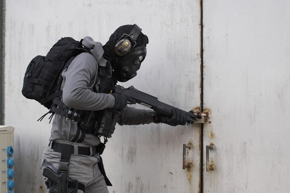 person wearing armor suit carrying shotgun