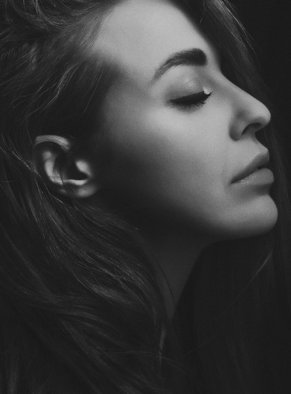 grayscale photography of woman facing sideways