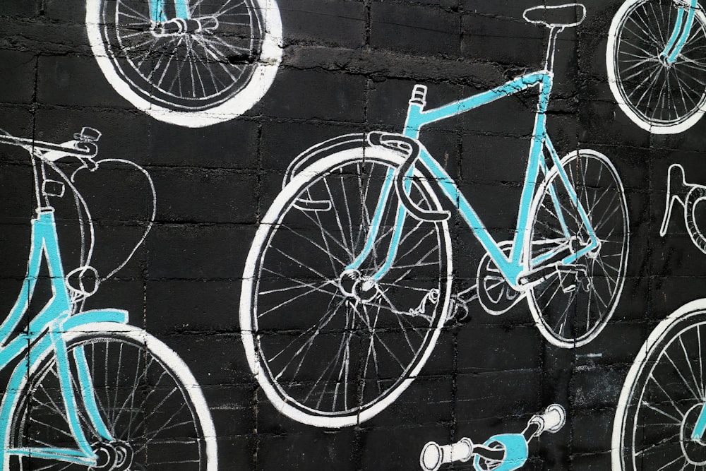 teal and white bicycle wall artwork