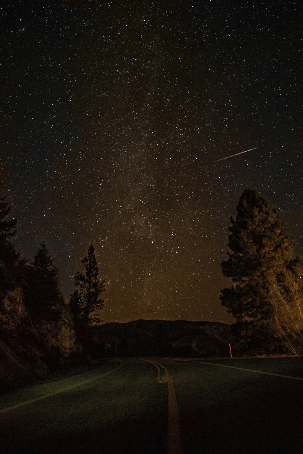 gray concrete road during nighttime