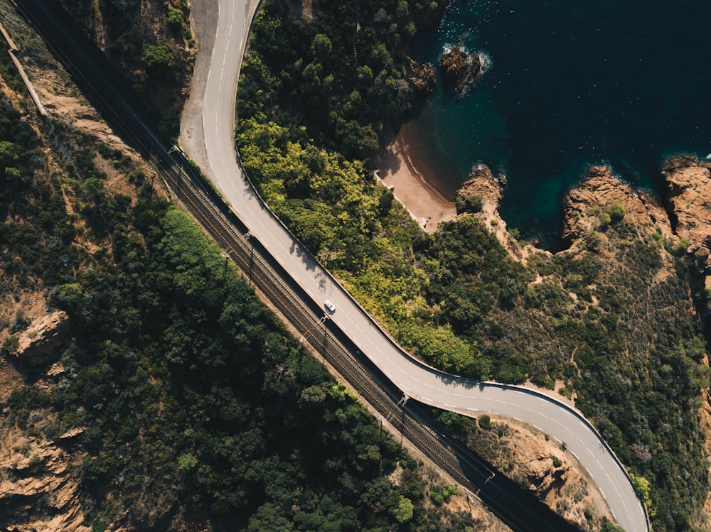 white car on paved road