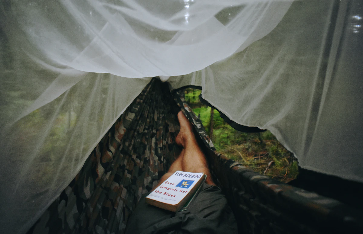 Sleeping pad setup inside tent at golden hour mountain campsite