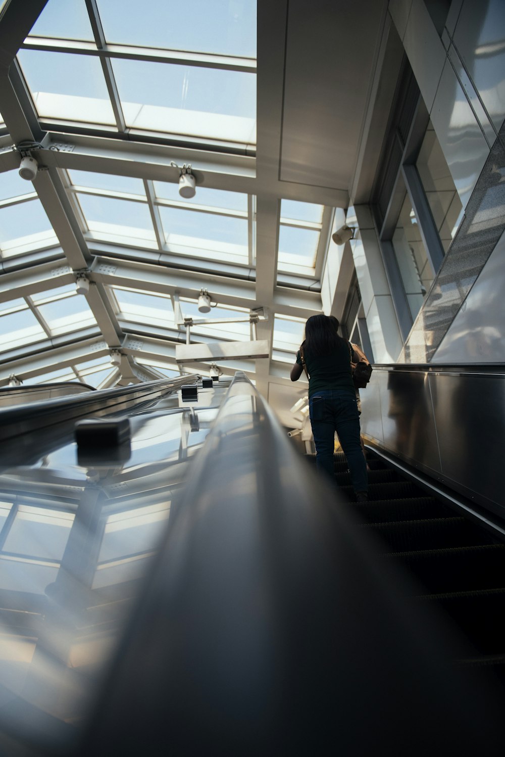 person standing escalator