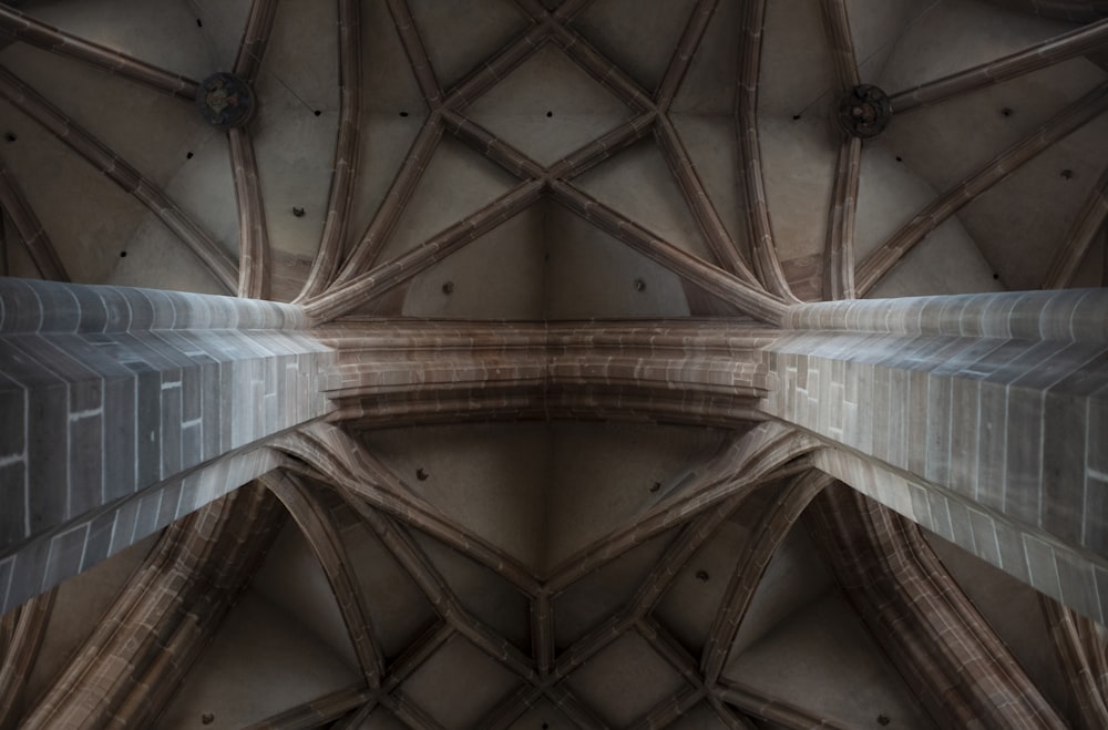 low angle photography of concrete building interior