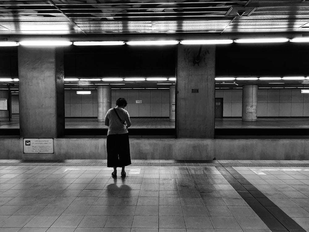 woman standing at the train station