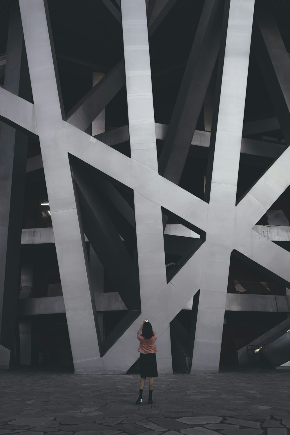 woman standing near building