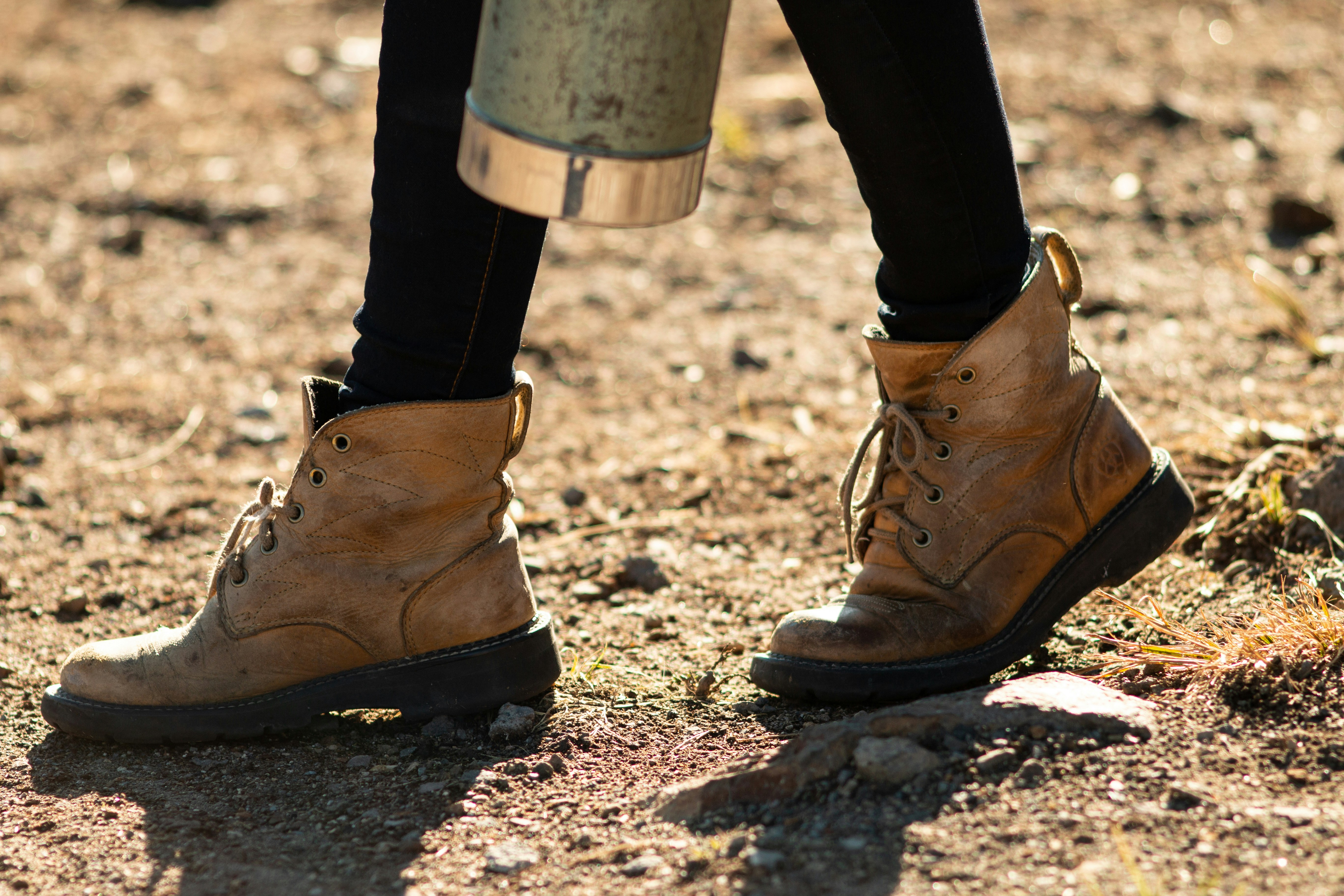 person wearing beige booties