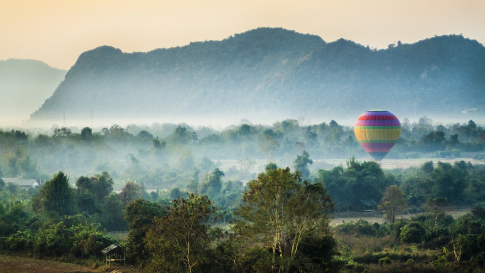 time lapse photography of flying hot air balloon