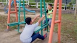 Children playing in a park, laughing and sharing toys.