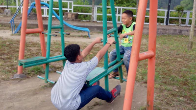 Children playing happily in a lively park during a family trip