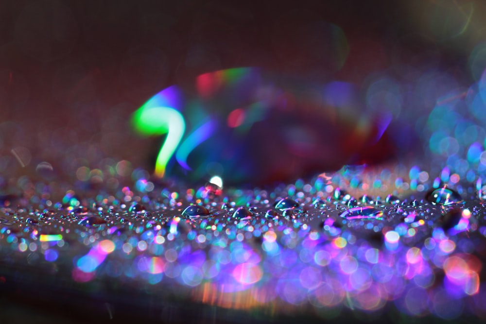 a close up of a computer keyboard covered in water droplets