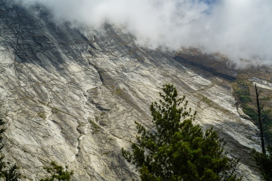 rock mountain during foggy weather in Manang Nepal