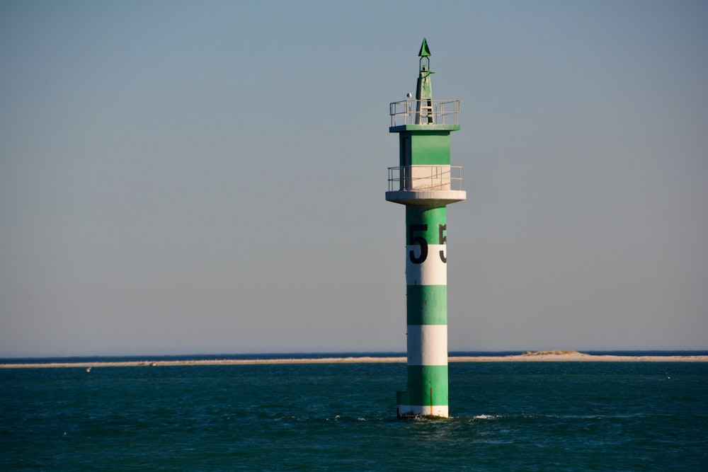 green and white lighthouse