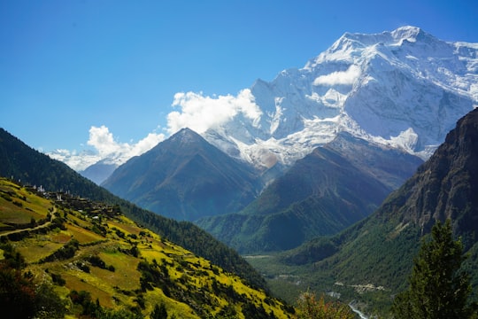 mountains during daytime in Annapurna Conservation Area Nepal