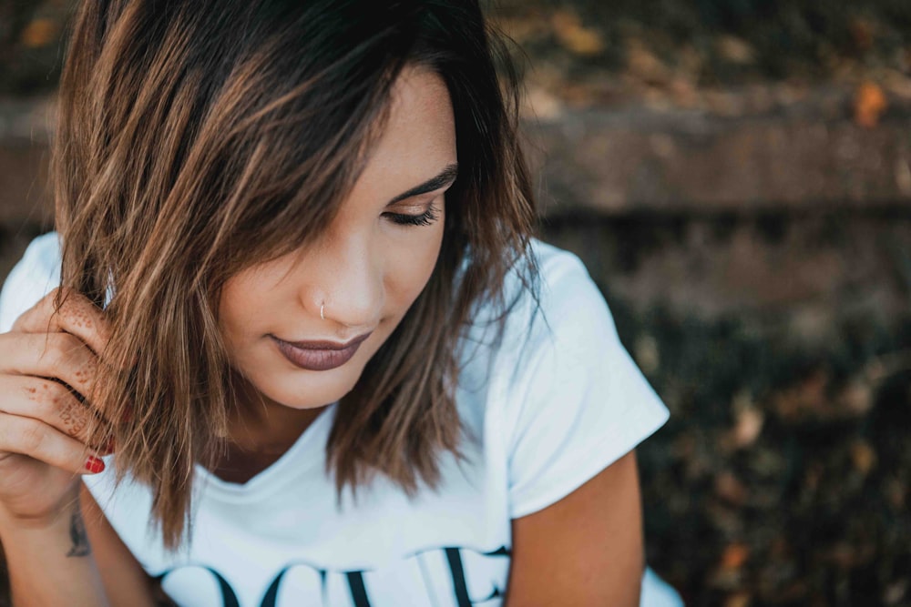 woman in white Vogue t-shirt