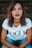 woman in white Vogue t-shirt and blue jeans