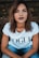 woman in white Vogue t-shirt and blue jeans