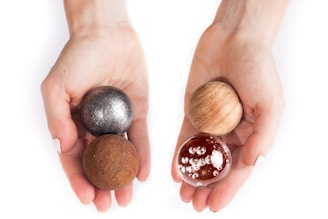 Close-up of hands holding a stress ball during a counseling session.