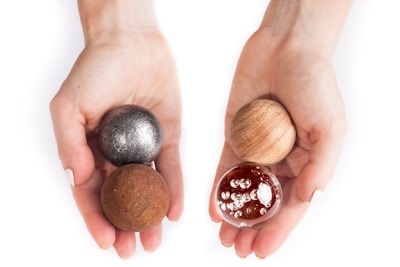 Close-up of hands holding a stress ball during a counseling session.