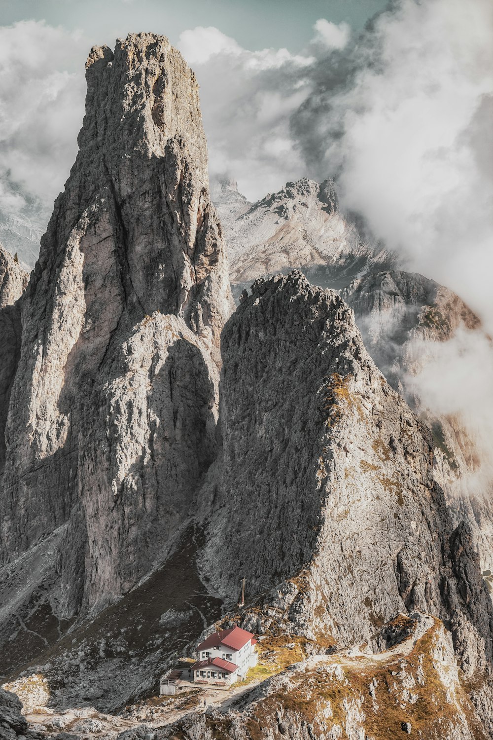 house by mountains during daytime