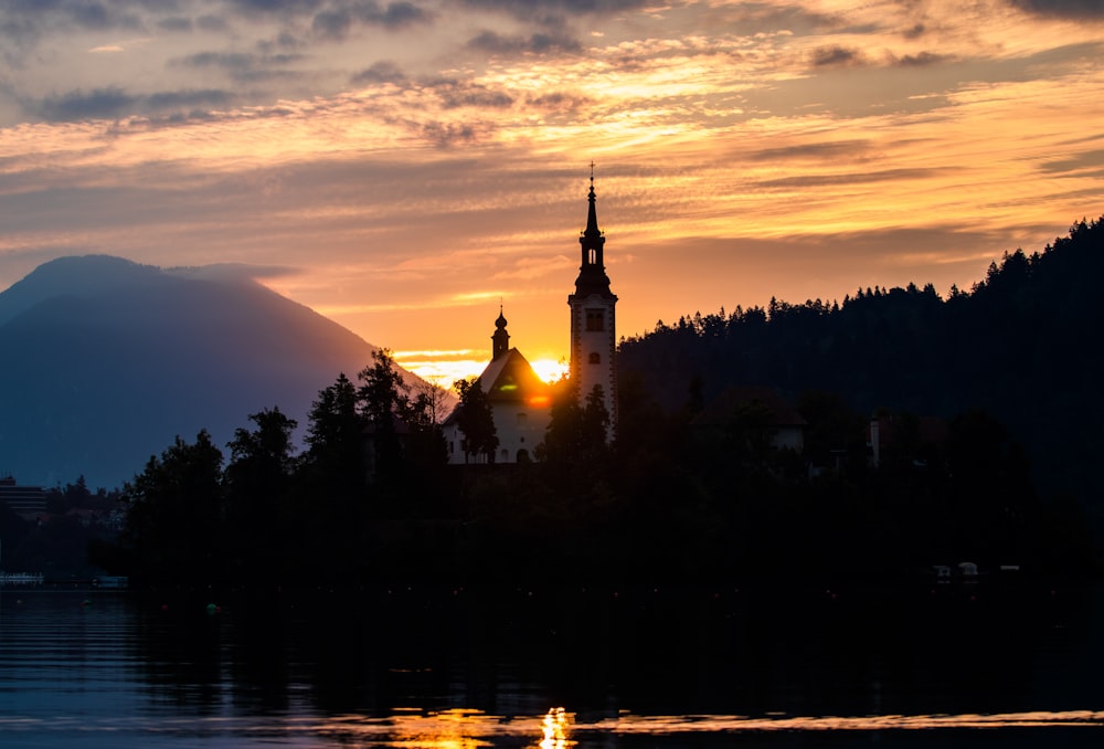 white cathedral near lake