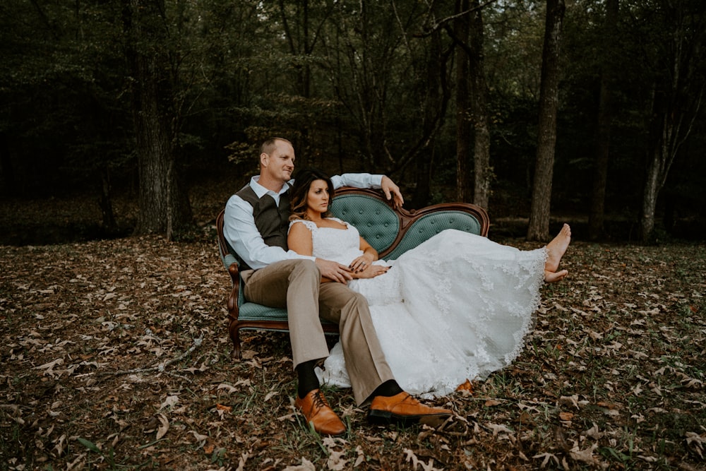 couple lying on sofa by treeline