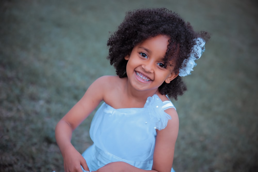 selective focus photography of girl while smiling