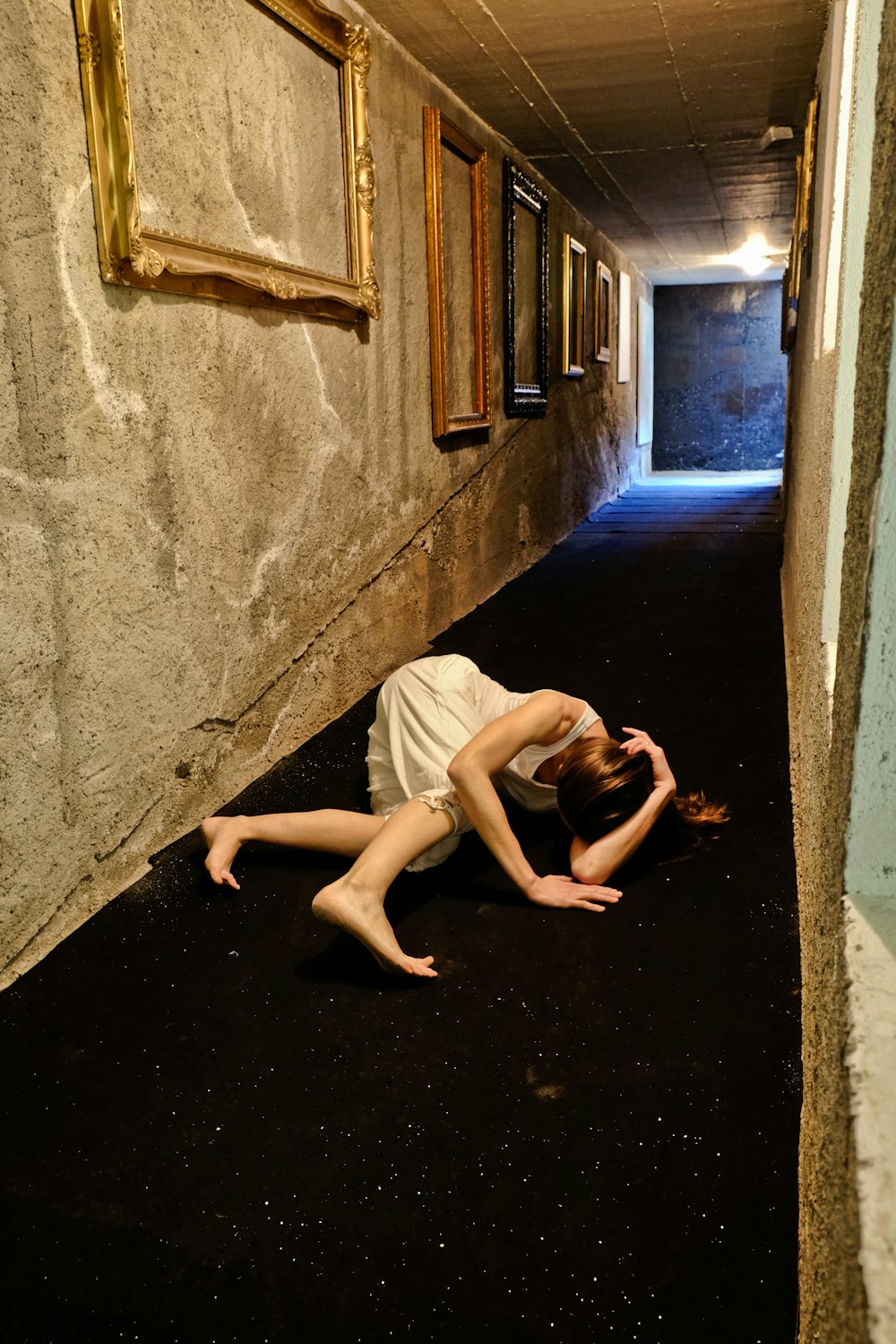 woman lying on hallway