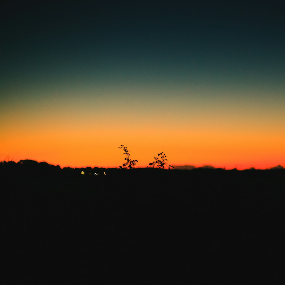 silhouette of mountain during sunset