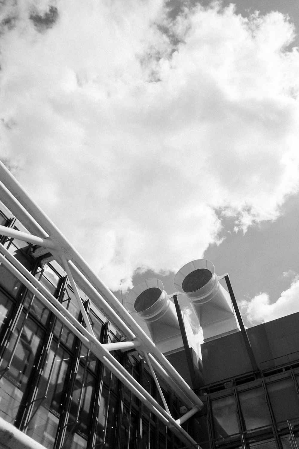 low-angle photo of building under clouds