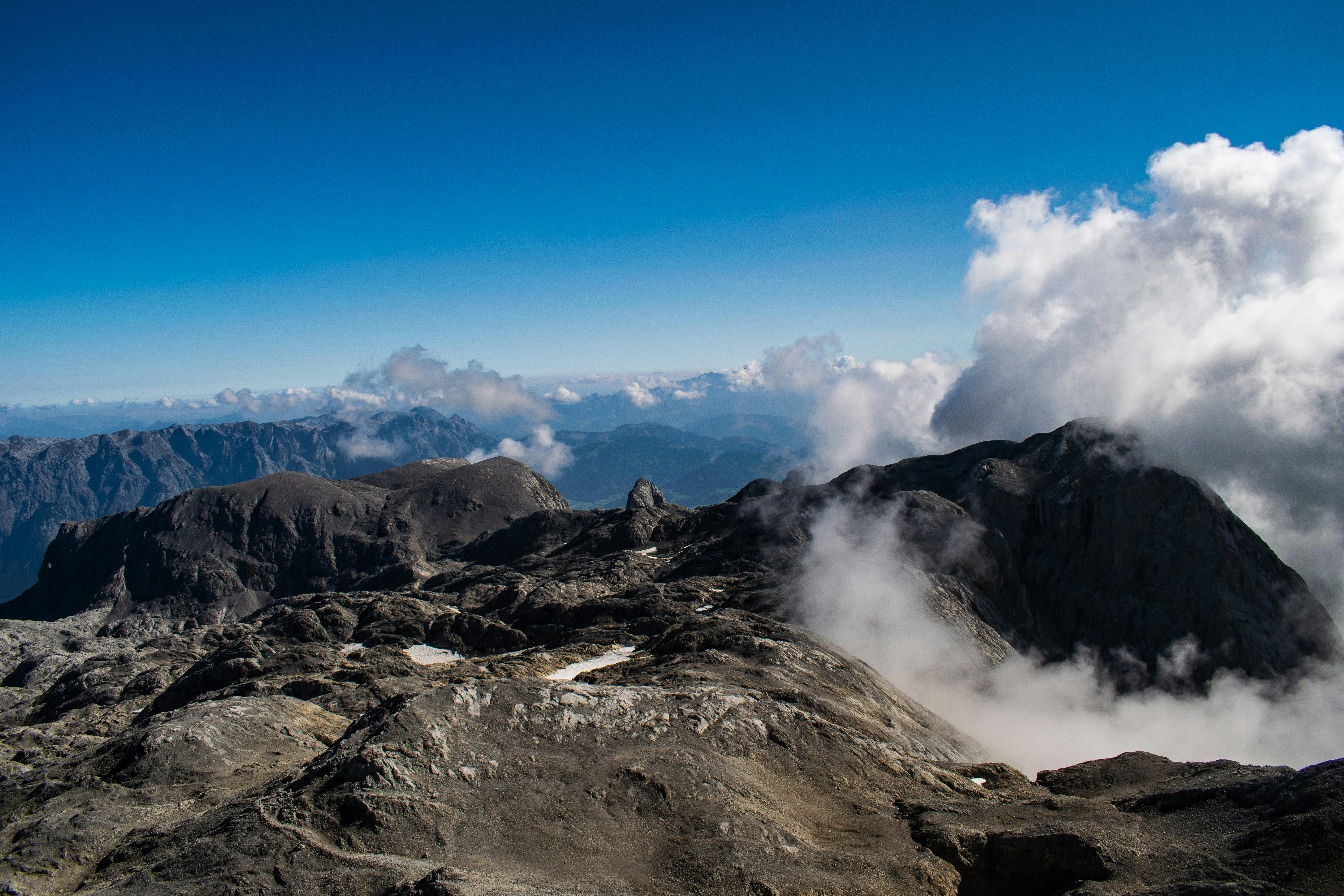 grey mountain under blue sky