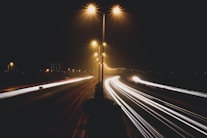 time lapse photo of cars passing by during nighttime
