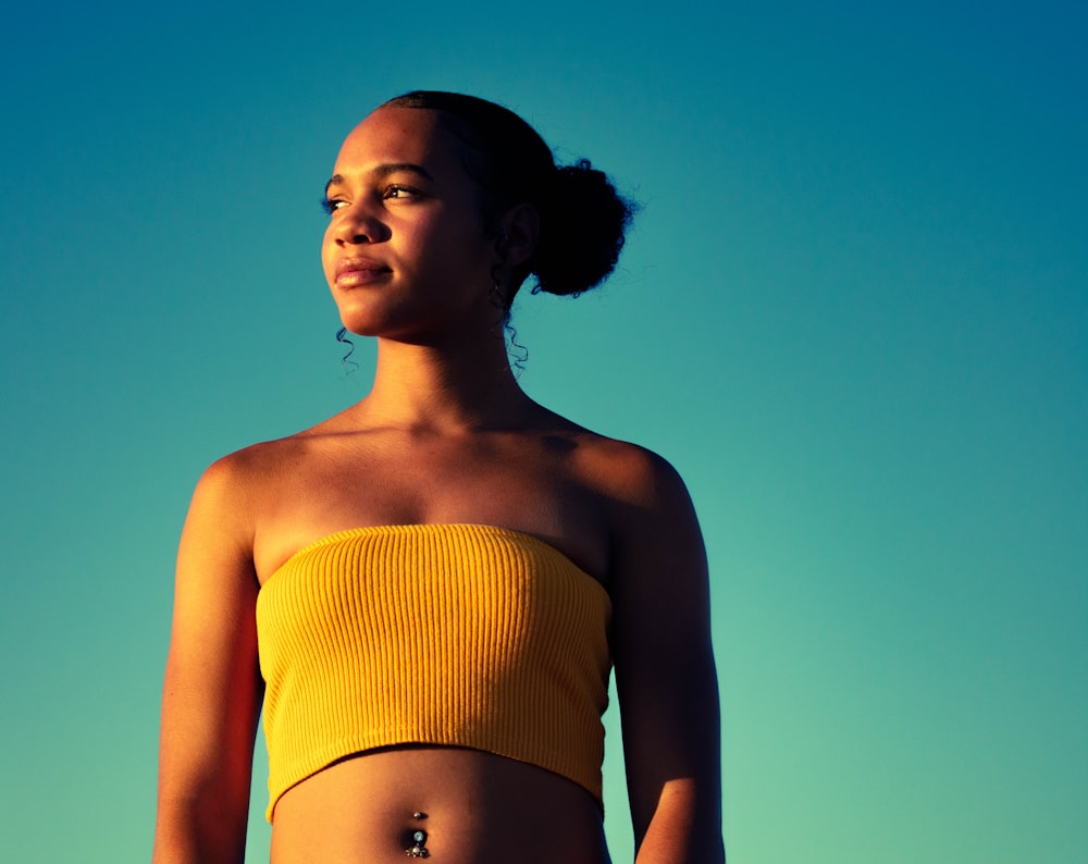 woman wearing yellow tube top