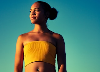 woman wearing yellow tube top