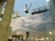 An outdoor shot showing large-format printed site hoarding panels installed around a building project.