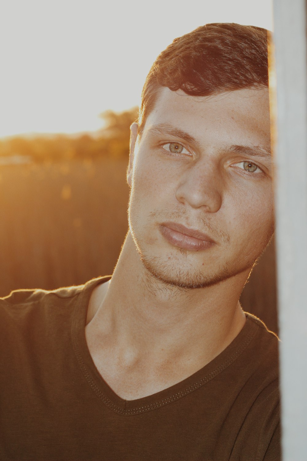 man in black V-neck shirt