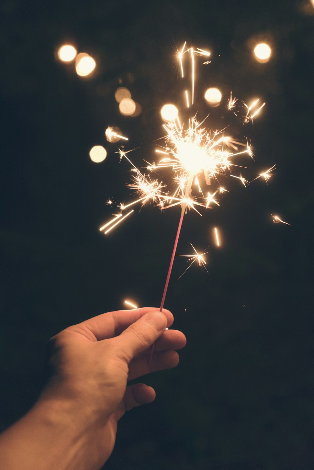 person holding sparkler