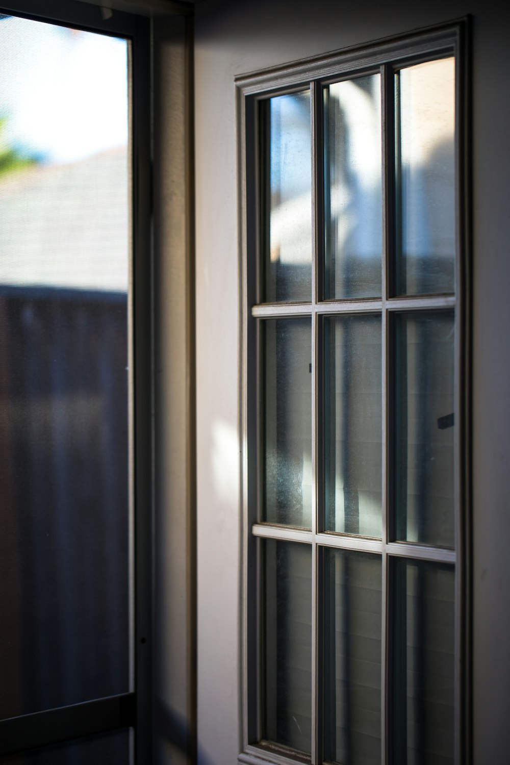 opened white wooden framed glass door