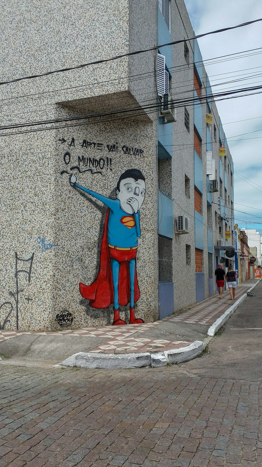 Superman graffiti at gray building