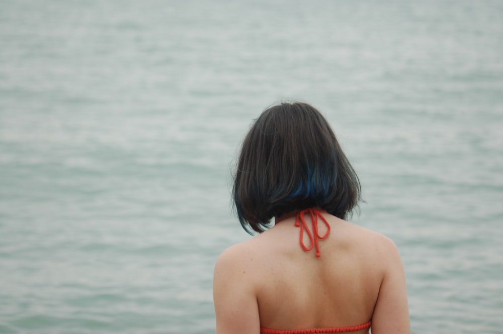 woman wearing red string bikini top