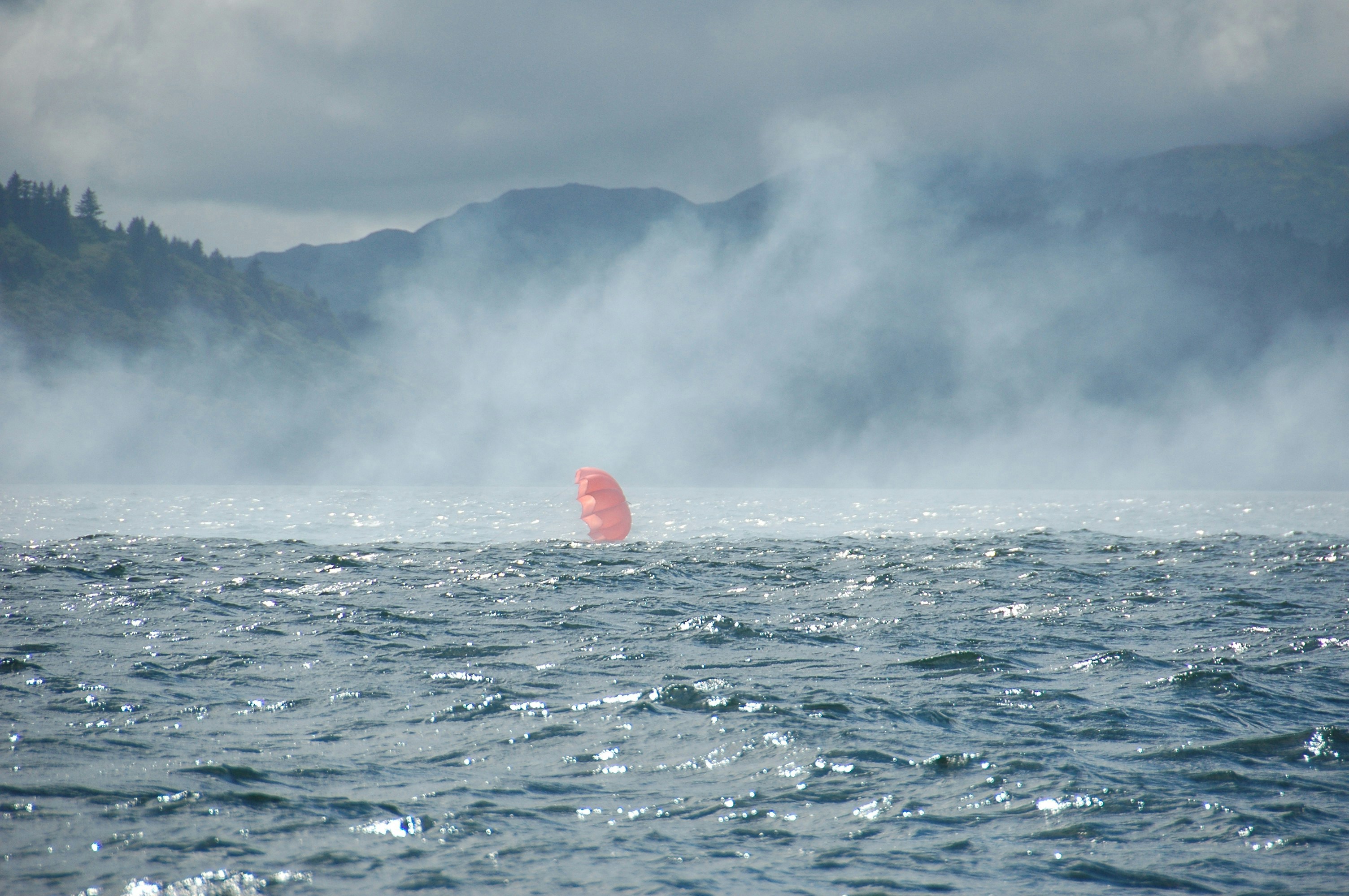 balloon sailing on body of water